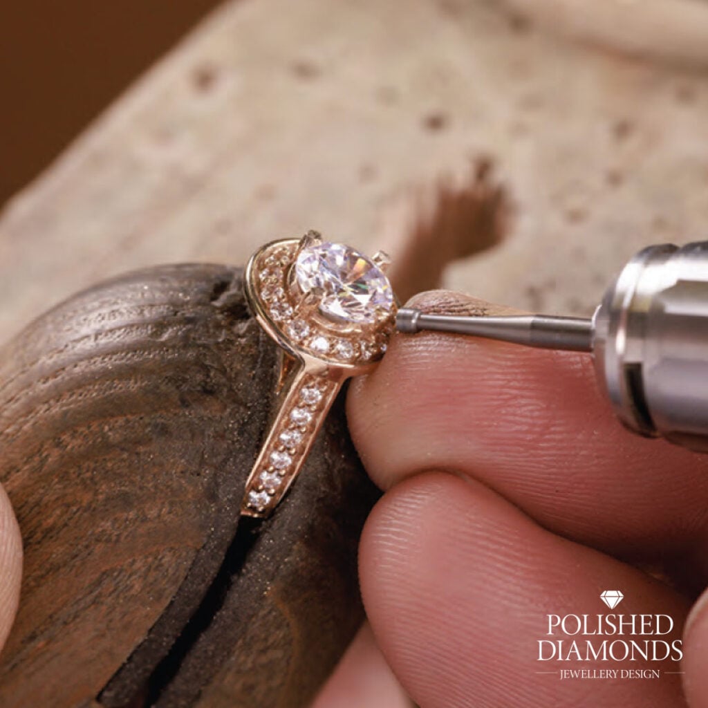 Setting Diamond into halo ring in workshop