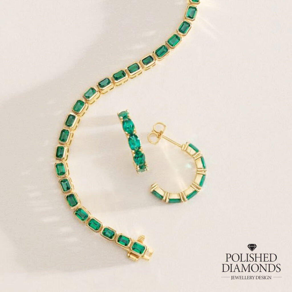 Emerald gold jewellery set earrings and bracelet