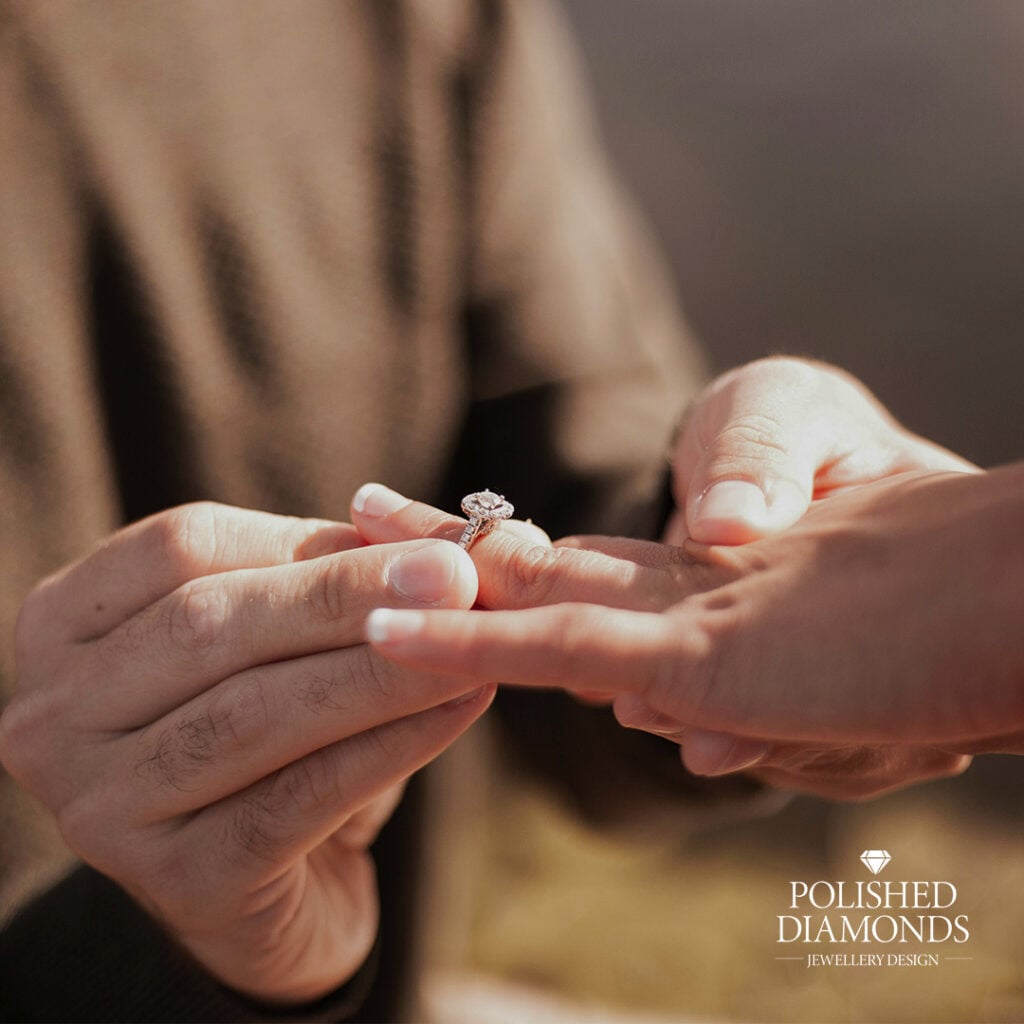 Putting engagement ring on finger after proposal