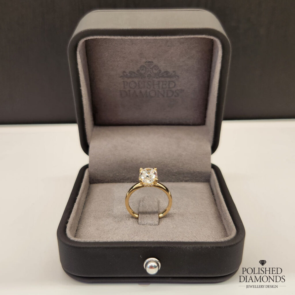 Gold diamond ring with hidden halo