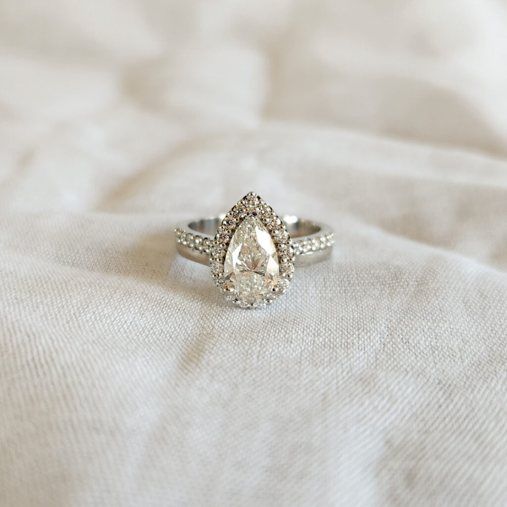 Pear halo engagement ring