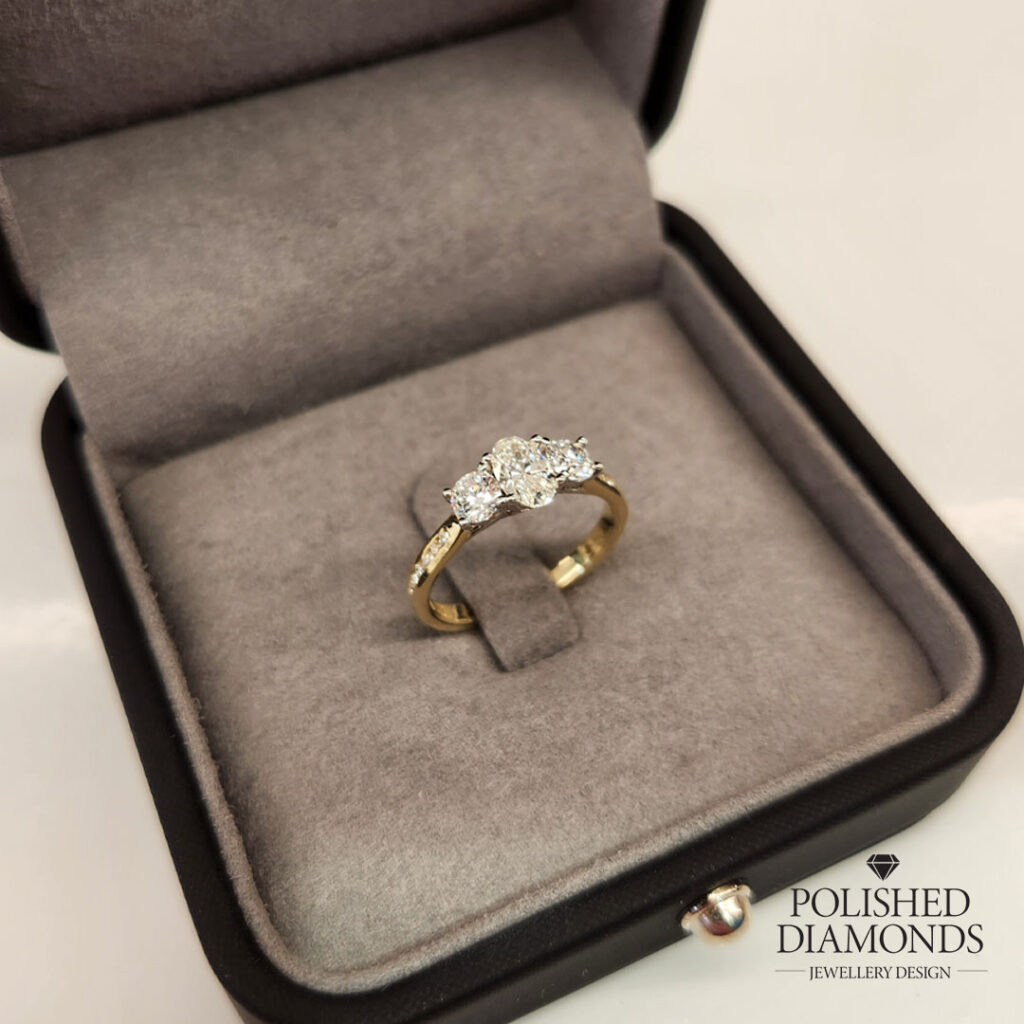Trilogy engagement ring with diamond accents Yellow Gold