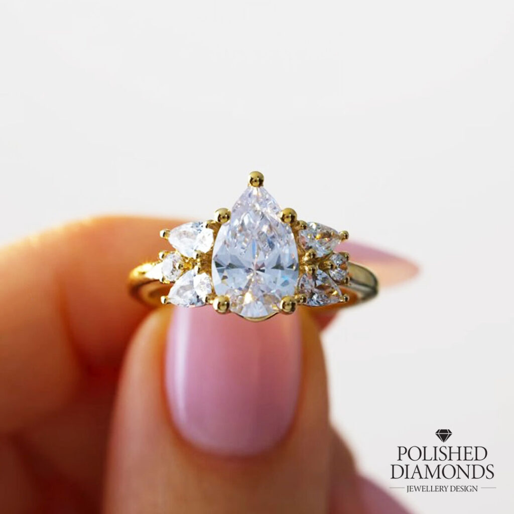 Pear-cut diamond yellow gold cluster ring