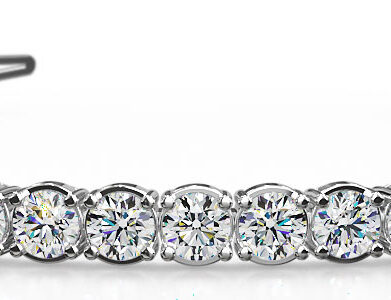 A stunning silver diamond tennis bracelet adorned with round, sparkling gemstones.